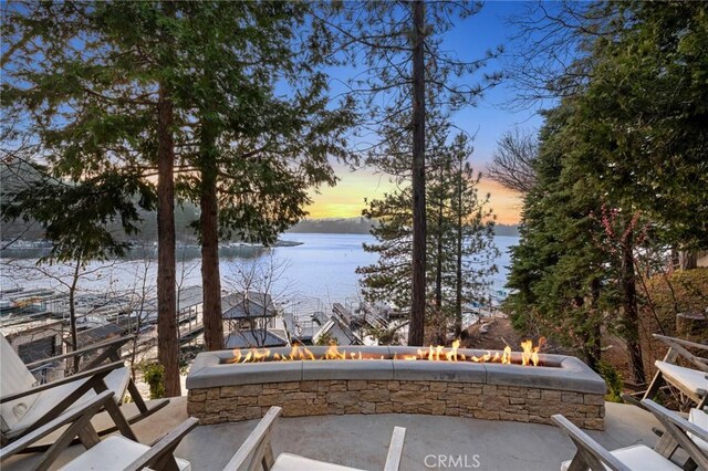 496 N State Highway 173, Lake Arrowhead, CA 92352 - view of patio / terrace featuring a fire pit and a water view