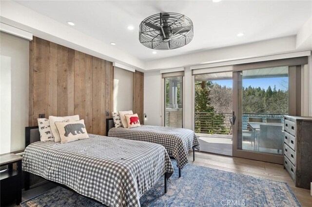496 N State Highway 173, Lake Arrowhead, CA 92352 - bedroom with access to outside, recessed lighting, wood walls, and wood finished floors