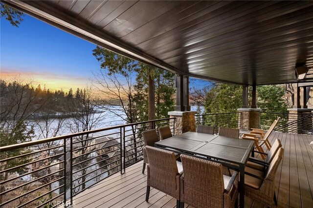 496 N State Highway 173, Lake Arrowhead, CA 92352 - deck at dusk featuring a water view and outdoor dining area