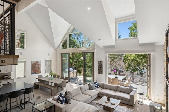 496 N State Highway 173, Lake Arrowhead, CA 92352 - living room with high vaulted ceiling and wood finished floors