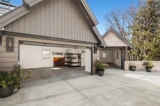 496 N State Highway 173, Lake Arrowhead, CA 92352 - view of property exterior with driveway, a garage, and board and batten siding