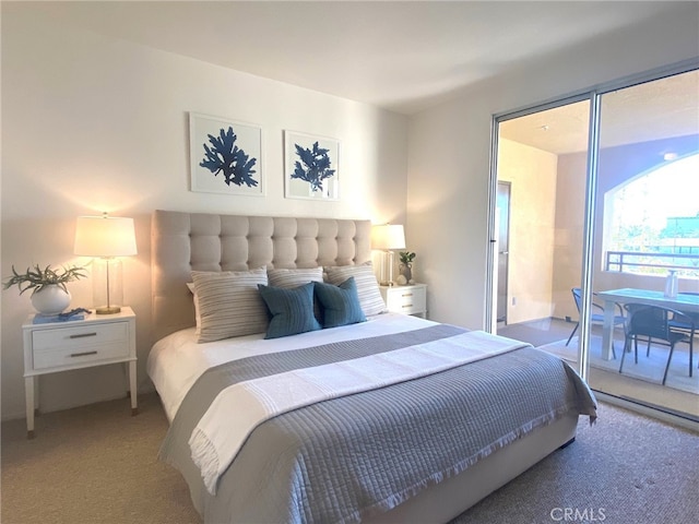 bedroom featuring access to exterior and carpet flooring