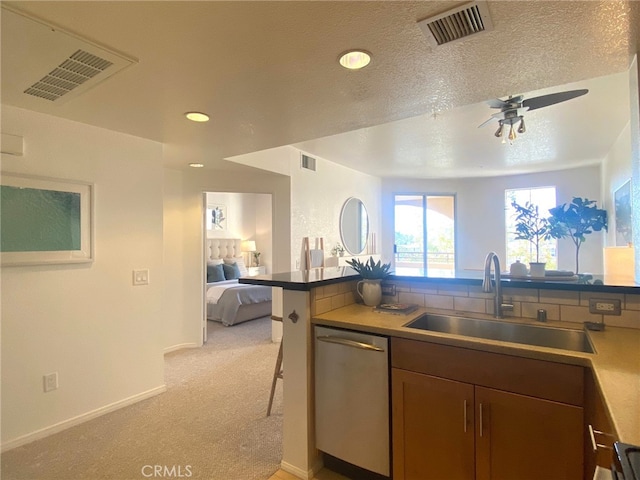 kitchen with a sink, visible vents, stainless steel dishwasher, and open floor plan