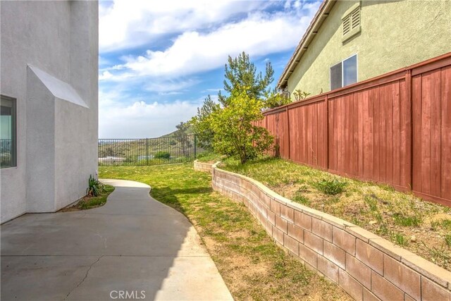 11834 Greenbluff Way, Yucaipa, CA 92399 - fenced backyard featuring a patio