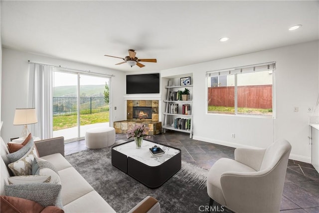 11834 Greenbluff Way, Yucaipa, CA 92399 - living room with ceiling fan, baseboards, a fireplace, built in features, and recessed lighting