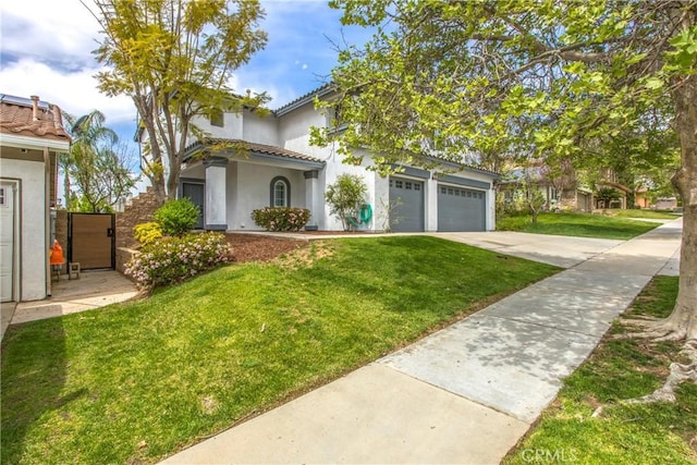 11834 Greenbluff Way, Yucaipa, CA 92399 - view of front of house with concrete driveway, stucco siding, a front lawn, an attached garage, and a tile roof