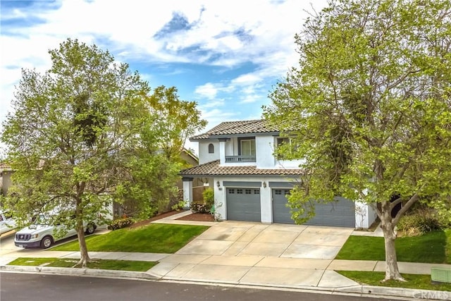 11834 Greenbluff Way, Yucaipa, CA 92399 - mediterranean / spanish-style house with a tile roof, a garage, driveway, stucco siding, and a front yard