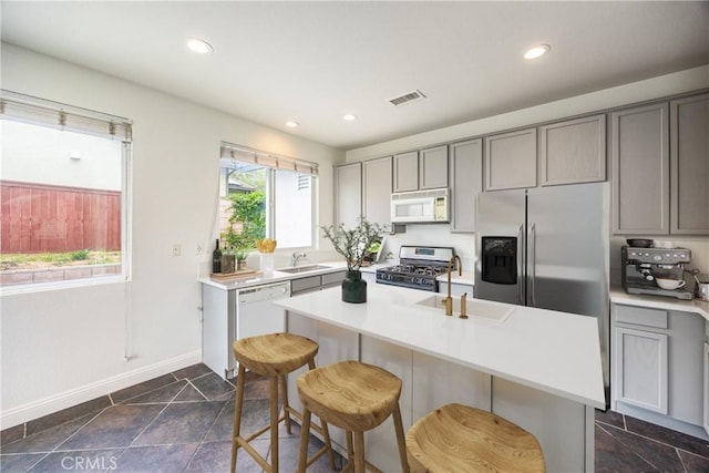 11834 Greenbluff Way, Yucaipa, CA 92399 - kitchen featuring white appliances, a sink, gray cabinets, baseboards, and light countertops