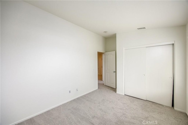 11834 Greenbluff Way, Yucaipa, CA 92399 - unfurnished bedroom with light colored carpet, a closet, and baseboards