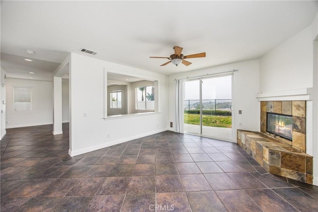 11834 Greenbluff Way, Yucaipa, CA 92399 - unfurnished living room featuring baseboards, a ceiling fan, a tiled fireplace, and recessed lighting