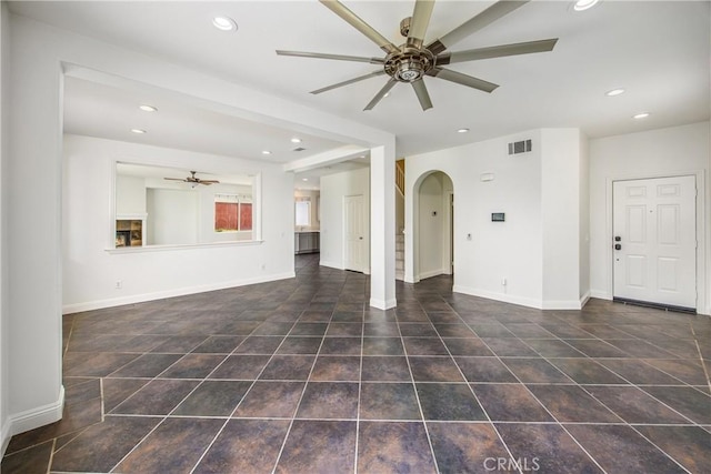 11834 Greenbluff Way, Yucaipa, CA 92399 - unfurnished living room featuring ceiling fan, arched walkways, recessed lighting, baseboards, and tile patterned floors