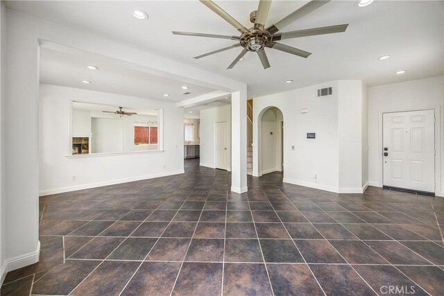 11834 Greenbluff Way, Yucaipa, CA 92399 - unfurnished living room featuring a ceiling fan, arched walkways, recessed lighting, and tile patterned floors