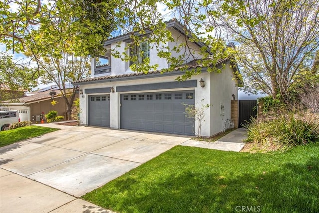 11834 Greenbluff Way, Yucaipa, CA 92399 - view of front facade with stucco siding, driveway, and a garage