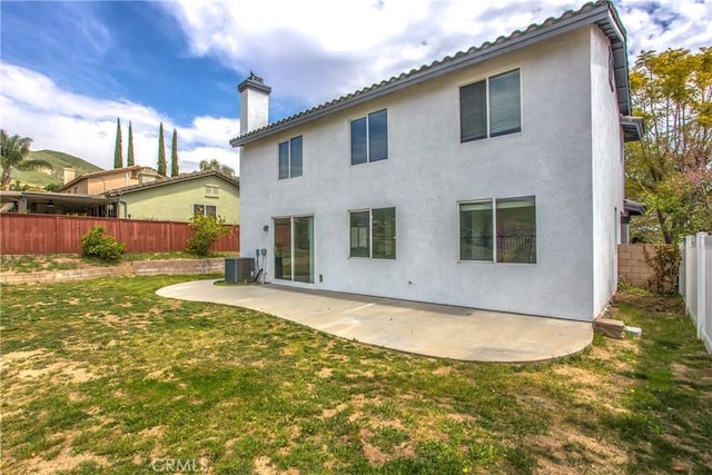 11834 Greenbluff Way, Yucaipa, CA 92399 - rear view of house with central AC, a patio area, a chimney, and stucco siding
