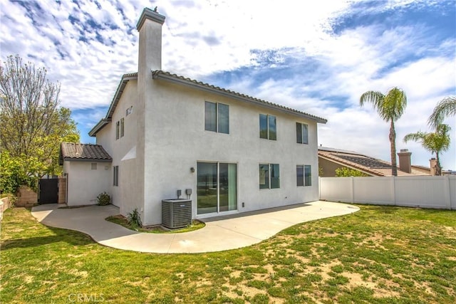 11834 Greenbluff Way, Yucaipa, CA 92399 - rear view of house with central air condition unit, stucco siding, a patio, a chimney, and a tile roof