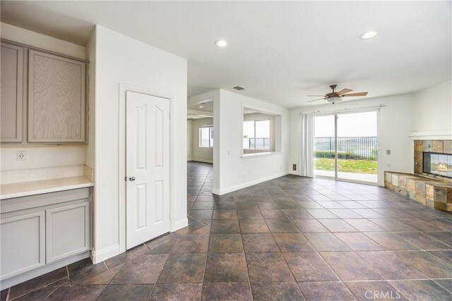 11834 Greenbluff Way, Yucaipa, CA 92399 - unfurnished living room with ceiling fan, a fireplace, and recessed lighting