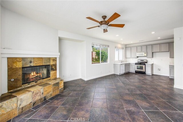 11834 Greenbluff Way, Yucaipa, CA 92399 - unfurnished living room with ceiling fan, a tile fireplace, and recessed lighting