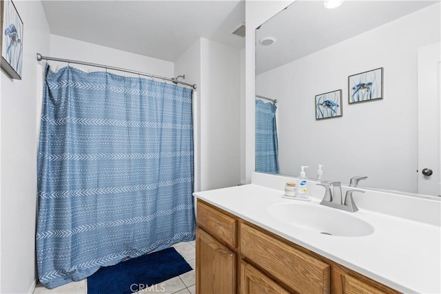 full bath with tile patterned flooring, vanity, and a shower with curtain