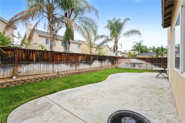 view of patio / terrace with a fenced backyard and a residential view