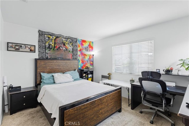 bedroom featuring light colored carpet