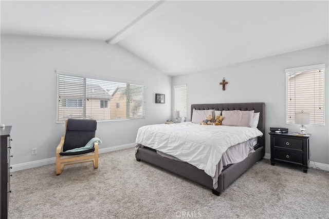 carpeted bedroom with baseboards and vaulted ceiling with beams