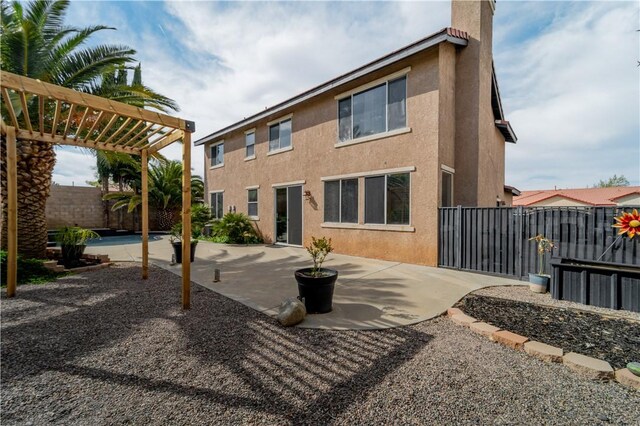 4022 Cocina Ln, Palmdale, CA 93551 - rear view of property featuring a pergola, a fenced backyard, stucco siding, a patio area, and a chimney