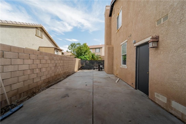 4022 Cocina Ln, Palmdale, CA 93551 - view of home's exterior with a patio, stucco siding, and a fenced backyard