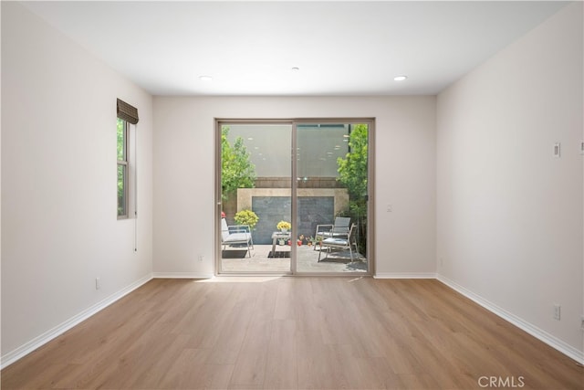 120 Halo, Irvine, CA 92618 - empty room featuring wood finished floors, baseboards, and recessed lighting