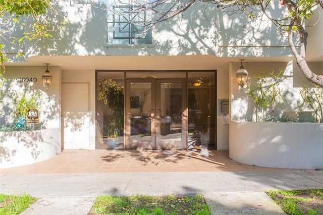 16040 W Sunset Blvd Unit 102, Pacific Palisades, CA 90272 - property entrance featuring french doors and stucco siding