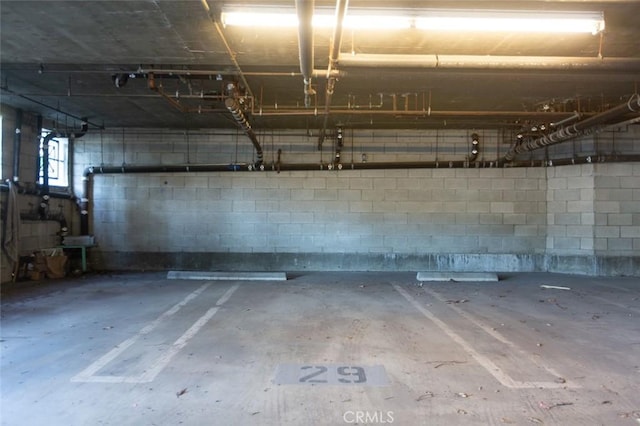 16040 W Sunset Blvd Unit 102, Pacific Palisades, CA 90272 - parking deck featuring concrete block wall