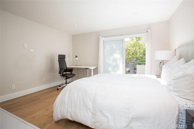 16040 W Sunset Blvd Unit 102, Pacific Palisades, CA 90272 - bedroom with wood finished floors and baseboards