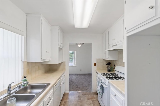 385 E Valley St, Coalinga, CA 93210 - kitchen with white cabinetry, under cabinet range hood, a sink, and white appliances