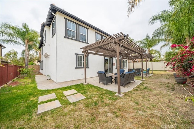 back of house with a fenced backyard, a pergola, a patio area, a lawn, and stucco siding