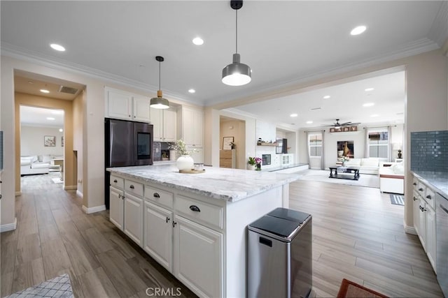 1639 Tivoli St, Redlands, CA 92374 - kitchen with a ceiling fan, backsplash, white cabinets, a center island, and open floor plan