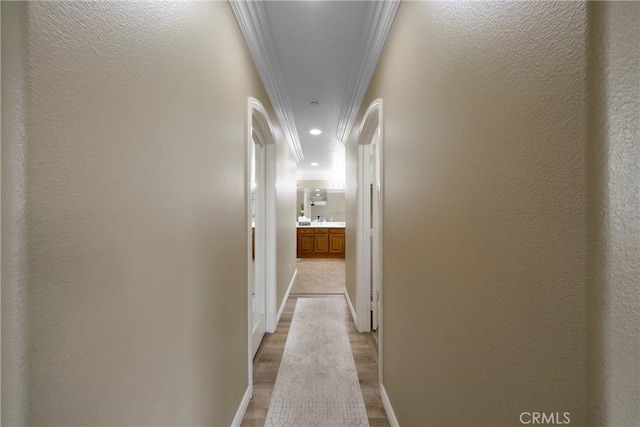 1639 Tivoli St, Redlands, CA 92374 - hall featuring crown molding, light wood-style flooring, and recessed lighting