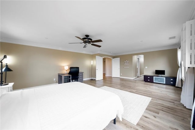 1639 Tivoli St, Redlands, CA 92374 - bedroom with a ceiling fan, crown molding, baseboards, arched walkways, and light wood-style floors