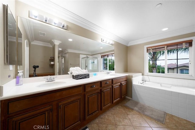 bathroom with tile patterned floors, double vanity, a sink, a garden tub, and a stall shower
