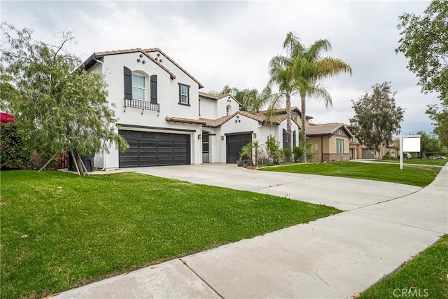 mediterranean / spanish-style home with stucco siding, a tile roof, driveway, and a front lawn