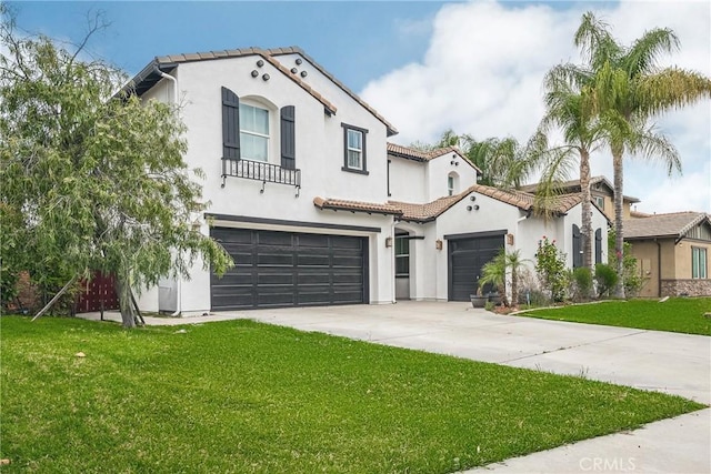 1639 Tivoli St, Redlands, CA 92374 - mediterranean / spanish house featuring stucco siding, a tile roof, driveway, and a front yard