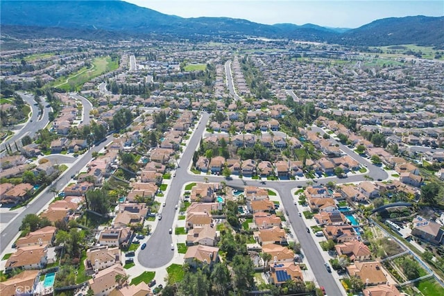 drone / aerial view featuring a mountain view and a residential view