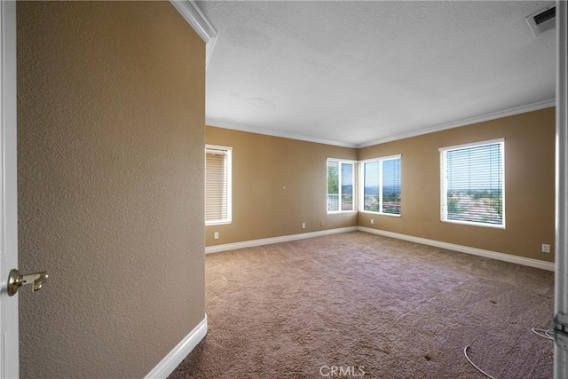 unfurnished room featuring a textured wall, visible vents, crown molding, and carpet floors