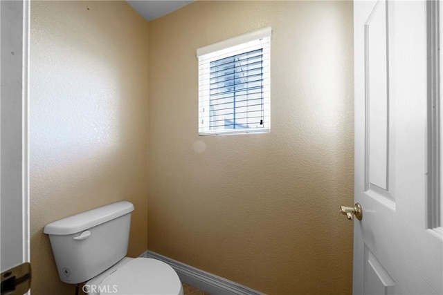 bathroom featuring toilet