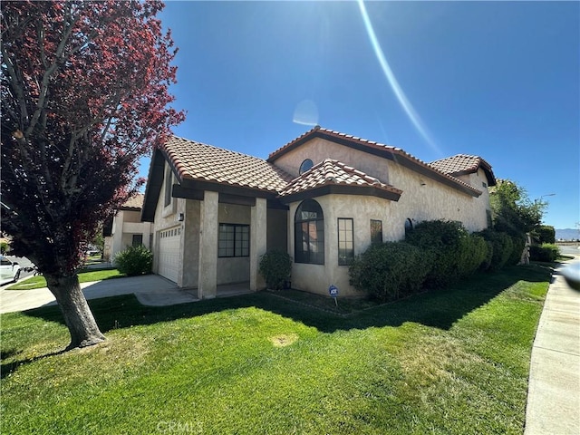 19229 Pine Way, Apple Valley, CA 92308 - mediterranean / spanish house with a garage, stucco siding, a tiled roof, a front lawn, and concrete driveway
