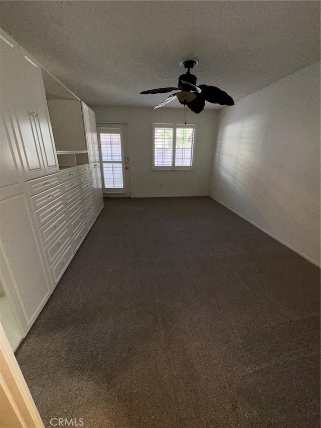 19229 Pine Way, Apple Valley, CA 92308 - spare room featuring dark colored carpet, ceiling fan, and a textured ceiling