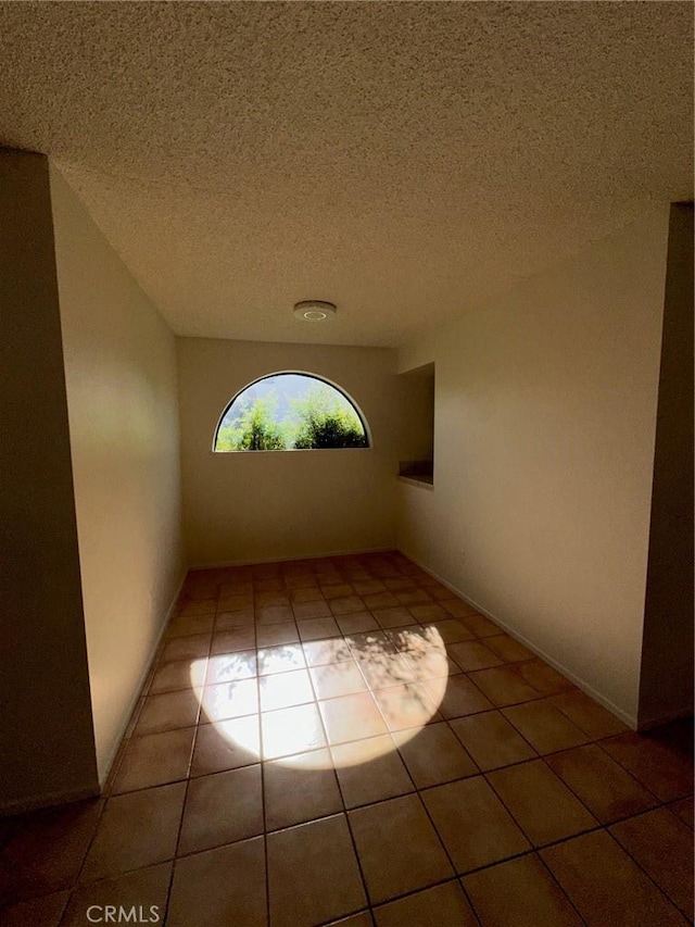 19229 Pine Way, Apple Valley, CA 92308 - hall with tile patterned floors and a textured ceiling