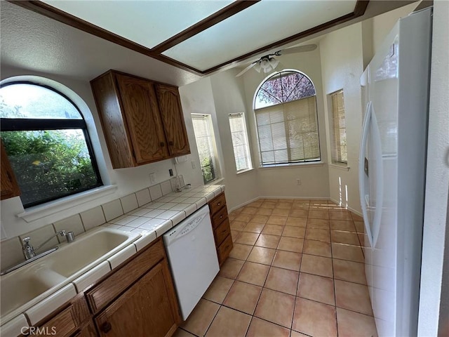 19229 Pine Way, Apple Valley, CA 92308 - kitchen with white appliances, tile counters, a ceiling fan, and plenty of natural light
