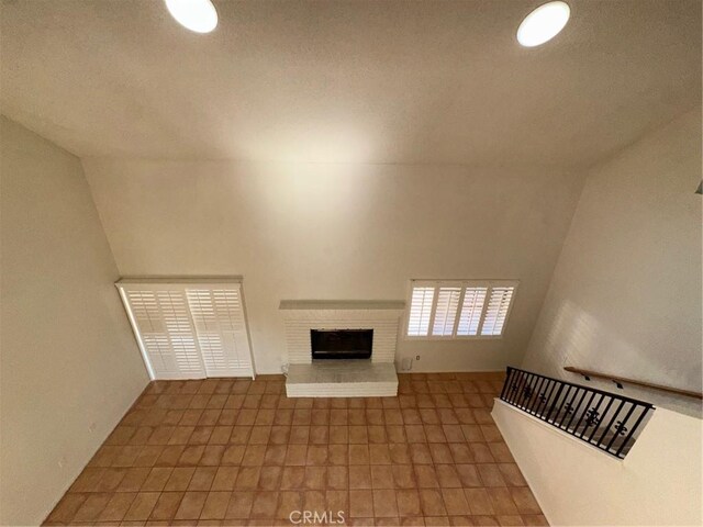 19229 Pine Way, Apple Valley, CA 92308 - unfurnished living room featuring a brick fireplace and recessed lighting