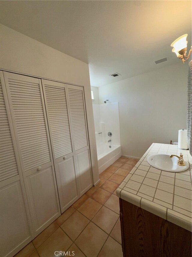 19229 Pine Way, Apple Valley, CA 92308 - full bathroom with a closet, tile patterned flooring, vanity, a chandelier, and shower / bath combination