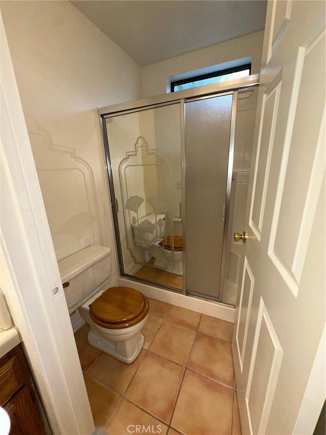 19229 Pine Way, Apple Valley, CA 92308 - bathroom with toilet, a shower stall, and tile patterned flooring