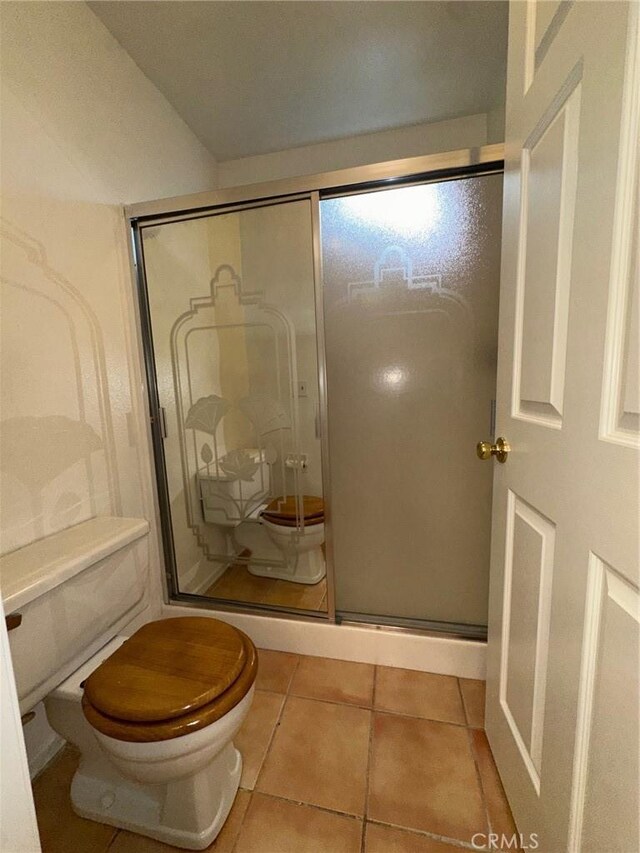 19229 Pine Way, Apple Valley, CA 92308 - bathroom with toilet, a shower stall, and tile patterned flooring